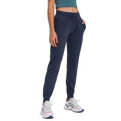 China Autumn With Pockets Comfortable Breathable Workout Pants High Waist Breathable Women Sports Pants Drawstring Womens Sports Tracksuit for sale