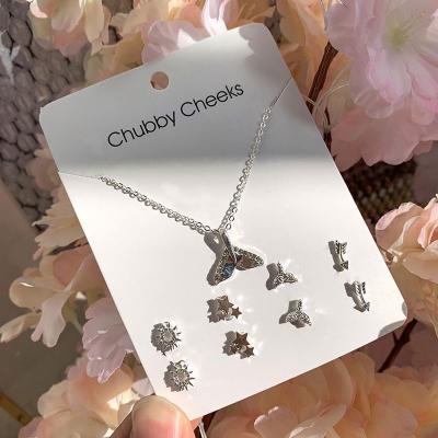 China 2022 Flower TRENDY Snowflake Crystal Rhinestone Cross Necklace Earrings Set Silver Plated Heart Jewelry Sets for sale