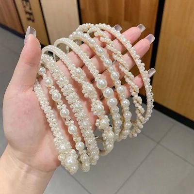 China Fashion white pearl beaded headband pearl bow hair accessories handmade elastic headband for girls for sale