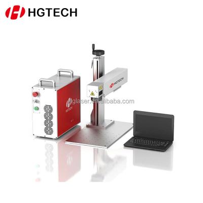 China Laser Engraving HGTECH 50w Computer Laptop Keyboard Mouse Fiber Laser Marking Machine With Raycus Laser Source for sale