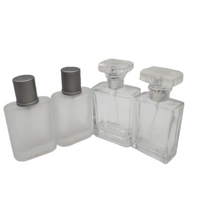 China 50ml 100ml Square Perfume Packaging Bottle Cosmetic Transparent Frosted Glass Perfume Spray Empty Bottle for sale