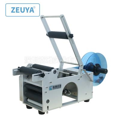 China Food tabletop electric manual labeling machine for round bottles and beverage bottles sticker labeling machine LT-50 for sale