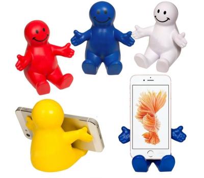 China Small Waterproof Man Shaped PU Cell Phone Stress Ball Smiley Soft Mobile Phone Holder Novelty Mobile Bracket Anti Stress for sale