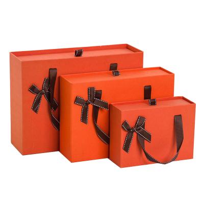 China Reusable Recycled Materials Tape Out Paper Boxes Colored Drawer Cardboard Gift Boxes Handle Boxes for sale