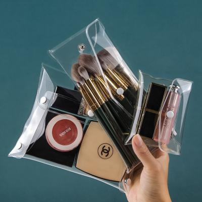 China Portable Make Up Custom Clear Pouch TPU Makeup Pouch PVC Cosmetics Brush Bag Transparent Storage Bags for sale