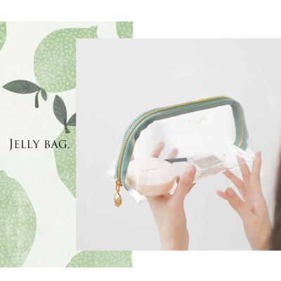 China Raincoat ; soft custom jelly logo pvc makeup purse shell clear make up cosmetic bag jelly makeup pouch for women for sale