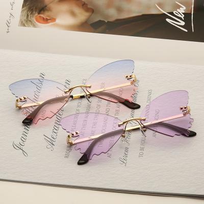 China BUTTERFLY hot sale rimless butterfly sunglasses women party luxury sunglasses 2021 high-end metal sunglasses for sale