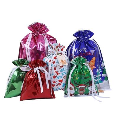 China 2021 Chirstmas Decor Christmas Gifts Foil Package Drawstring Gift Sack Bag Luxury Christmas Gifting Packaging for sale