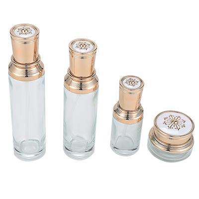 China Luxury Personal Care Glass Bottle Cosmetic Set--skincare container manufacturer--electroplating aluminum with pump&spray&engrave cap for sale