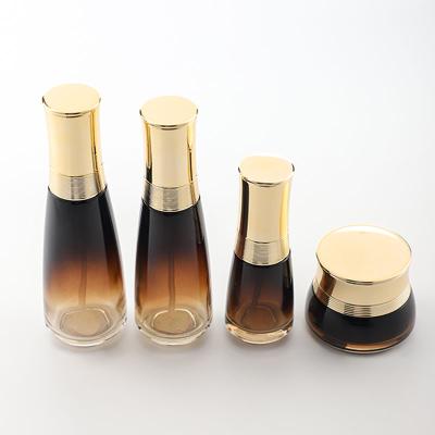 China Personal care glass bottle cosmetic set--luxury skincare packaging container manufacturer--new design with pump&spray&gold cap for sale