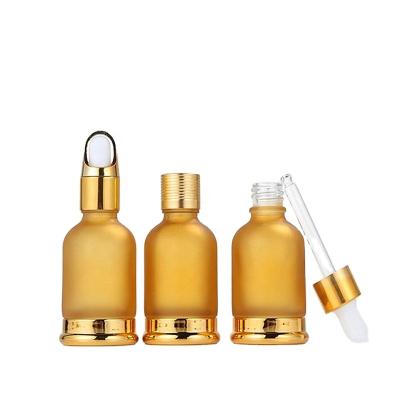 China High quality 30ml personal care frosted gold color dropper glass bottle for smoke oil with dropper/pump/spray for sale