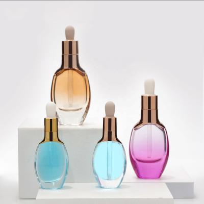 China Personal Care Essential Oil Dropper Glass Bottle Skin Care Cosmetic Serum Glass Packaging Container Custom Glass Bottle for sale