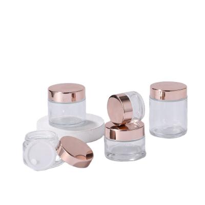 China Hot Sale Personal Care Cream Glass Bottle 5g~100g Fashion Cream Body Scrub Glass Cosmetic Container Packaging Bottle With Rose Gold Cover for sale