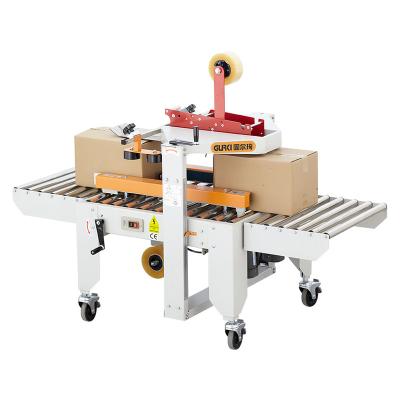 China Manual Food Carton Case Box Sealer Machine Manual End Sealer Machine With Strip for sale