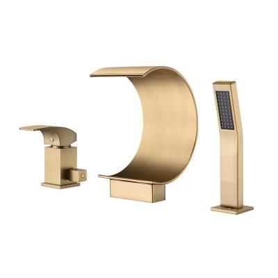 China Modern Swept Gold Waterfall Bathroom Tub And Shower Faucet Deck Mounted Luxury Bathtub Mixer Tap for sale