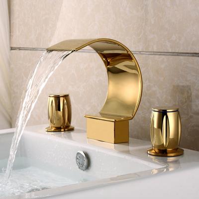 China Contemporary Modern Gold Waterfall Deck Mount Three Holes Brass Basin Faucet for sale