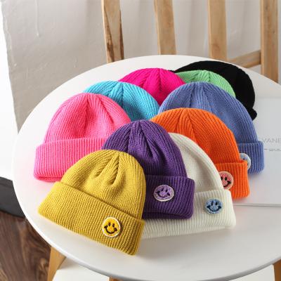 China JOINT LOGO Custom Cute Baby Beanie Hat Knitted Hat With Smiling Face For 0 - 3months Kids for sale