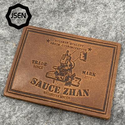 China Sustainable hot sale debossed logo brand leather brown label patch for sale