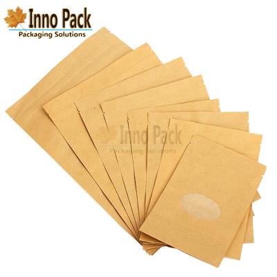 China Moisture Proof Clear Window Kraft Paper Snack Packaging Bag With Zipper for sale