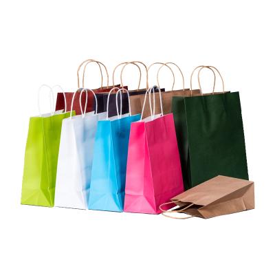 China Recycled Materials Wholesale Kraft Paper Bag Gift Wrapping Paper Bag With Handle for sale