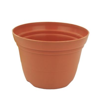 China New durable pp resin flower pot round flower pot with holes at the bottom of the good air permeability flower pot uses for sale