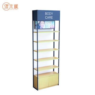 China New Design Fashion Store Cosmetics Stand Up Display Logo Makeup Display Stand With Custom Lights for sale