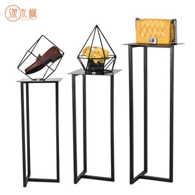 China Shopping Mall Fancy Retail Store Bag Display Stands Custom Design Rotating Pedestal Shoe Display Stand for sale