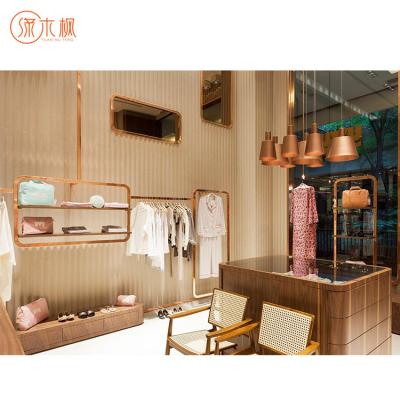 China Fashion Fully Assembled Luxury Clothing Boutique Display Furniture Clothing Display Stand for sale