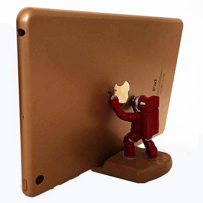 China Lazy Cell Phone Holder Mobile Stand Astronaut Phone Pad Desktop Holder For Home Decoration for sale