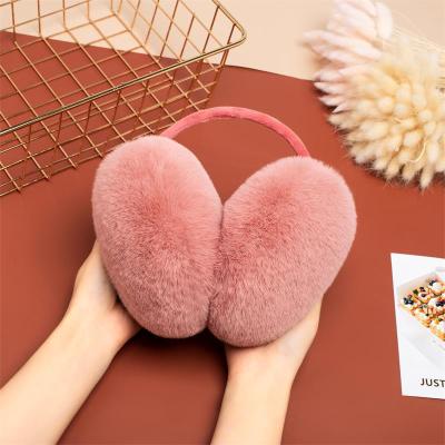 China After wearing type earmuffs winter wool balls large for both men and women outdoor warm pure color plush earmuffs custom wholesale for sale