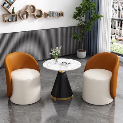 China Nordic Luxury High Quality Oil Wax Salon Rotating Leather Chair Set Space Saving Furniture 360 ​​Degree Swivel Chair for sale