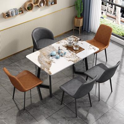 China Comfortable Nordic PU Leather Restaurant Tables Space Saving Furniture Dining Table Set Modern 6 Chairs for sale