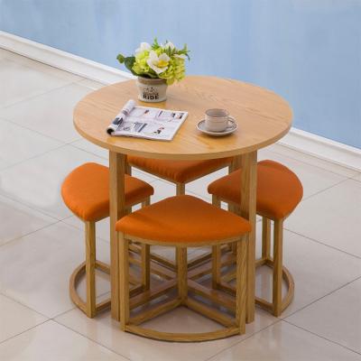 China Comfortable Space Saving Round Base Home Wood Dining Table Set With 4 Chairs Universal Furniture for sale