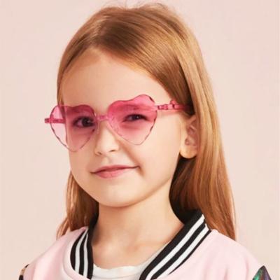 China Fashion Sunglasses Shape Kids Rimless Heart Sun Glasses Children Babies Heart Shaped Plastic Child Glasses Lovely Boys Eyewear UV400 for sale