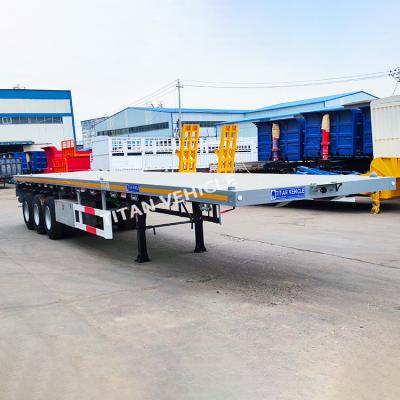 China TITAN 40 Ft 3 Axle Container Transport Flatbed Truck Trailer Semi Trailer for Sale in Tanzania zu verkaufen