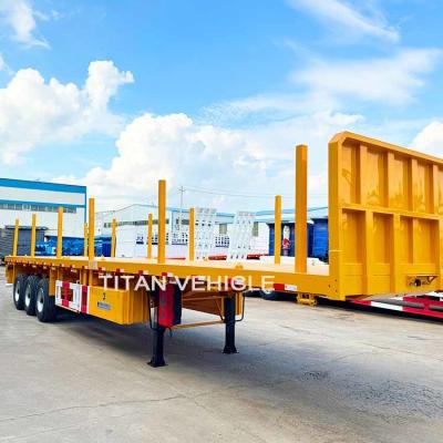 Cina TITAN 3 Axle Flatbed Trailer wilth Columns Wood Log Trailer Timber Trailer Wood Steel Pipe Transport Trailer for Sale in vendita