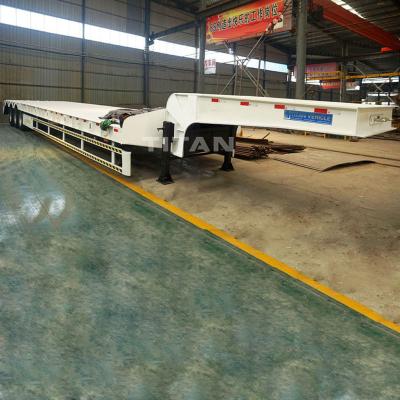 中国 TITAN excavator low bed trailer low bed truck trailer tri-axle low bed trailer 60 tons for sale 販売のため