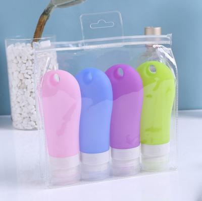 China 38ml 60ml 90ml Silicone Food Grade Squeeze Silicone Travel Food Grade Collapsible Bottle Set With Hanging Hole for sale