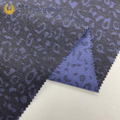 China Stretch novelty leopard jacquard two tunes combined single pattern fabric warp casual stretch fabric for sale