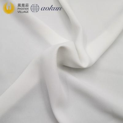 China Stain Resistant Hot Selling Phoenix Village Polyester Spandex Fabric Bi-stretch Plain Crepe Woven Fabric For Suit And Pant for sale