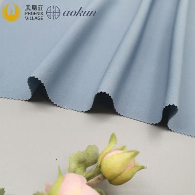 China Phoenix Sustainable Village Hot Sale Polyester Spandex Fabric Bi-stretch Woven Fabric For Suit And Pants for sale