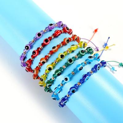 China Environmently Friendly Wholesale Handmade Braided Wax Rope Thread Women Adjustable Ladies Charm Red Blue Turkish Evil Eye Bead Bracelet Jewelry for sale