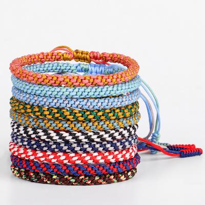 China Lucky Tibetan Buddhist Handmade Braided Adjustable Men Women Bracelet For Multi Colors Silk String Knot Environmentally Friendly Ethnic Style for sale