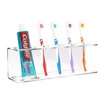 China Viable Modern Wall Mounted Clear Bathroom Organizer Acrylic Toothpaste Toothpaste Shelf Holder Rack for sale