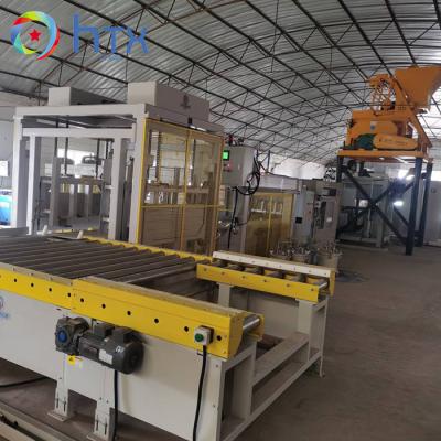 China Automatisch PLC-besturingssysteem Vernissteen Productielijn Betonhoudende blokvulmachine Te koop