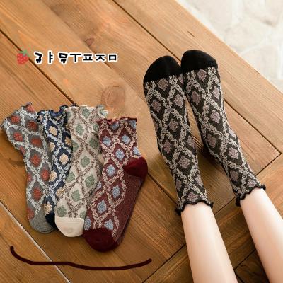 China New Autumn And Winter QUICK DRY Female Socks Diamond Retro Style College Wind Tube Socks for sale