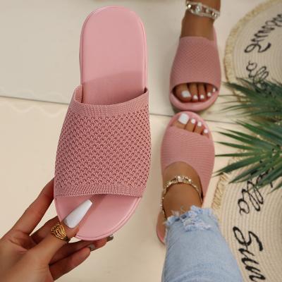 China Damping Famous Designer Brands Summer Women's Knitting Weaving Sandals Cute Pink Woman Fly Tending Low Heels Slippers For Women for sale