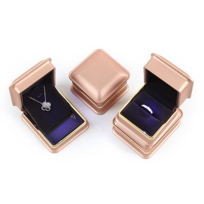 China Fashionable High End Custom Romantic Red Pendant Necklace Ring Gold Black Jewelry Box With Led Light for sale