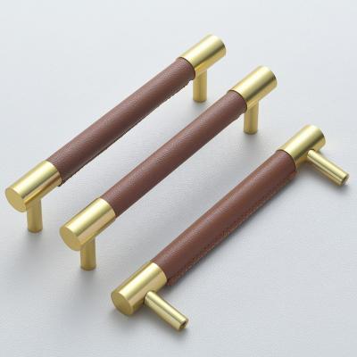 China Modern luxury cabinet handles gold puxador clamping lever wardrobe door handle solid brass cabinet drawer leather pull for sale