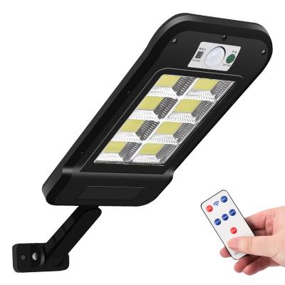 China ROAD Outdoor Security Ipx65 Waterproof Smart Garden Wall Lamp 120 COB Pir Motion Sensor Solar Led Remote Control Street Lights for sale